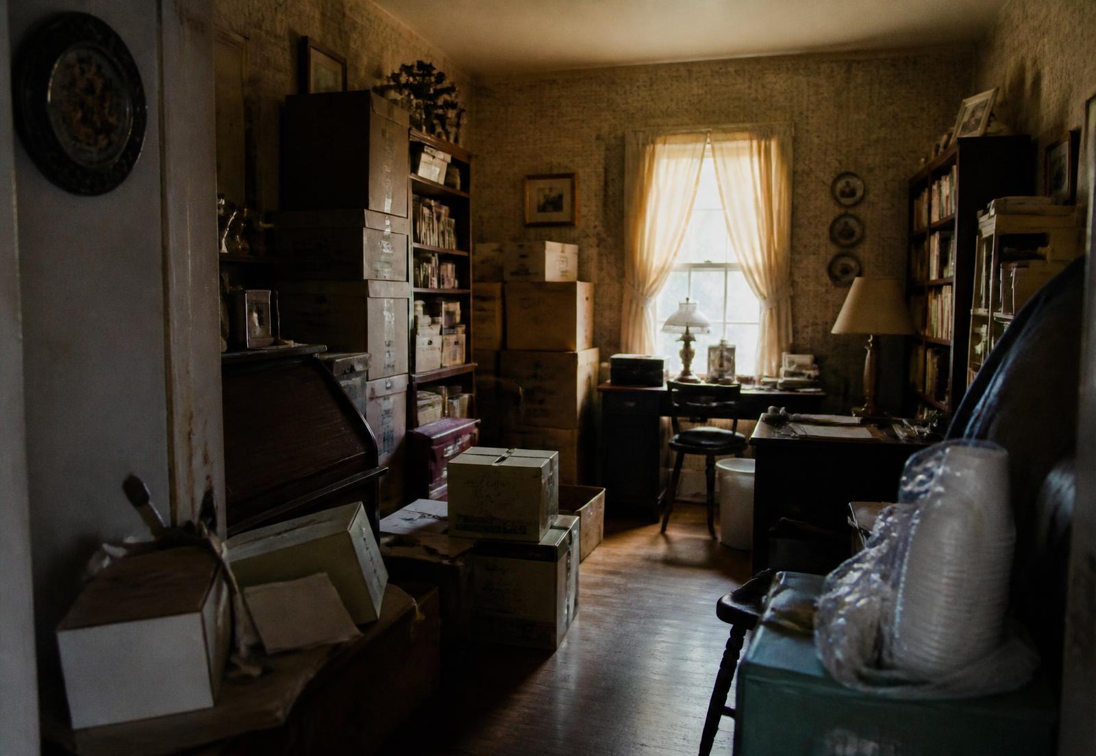 Room stacked with boxes and furniture